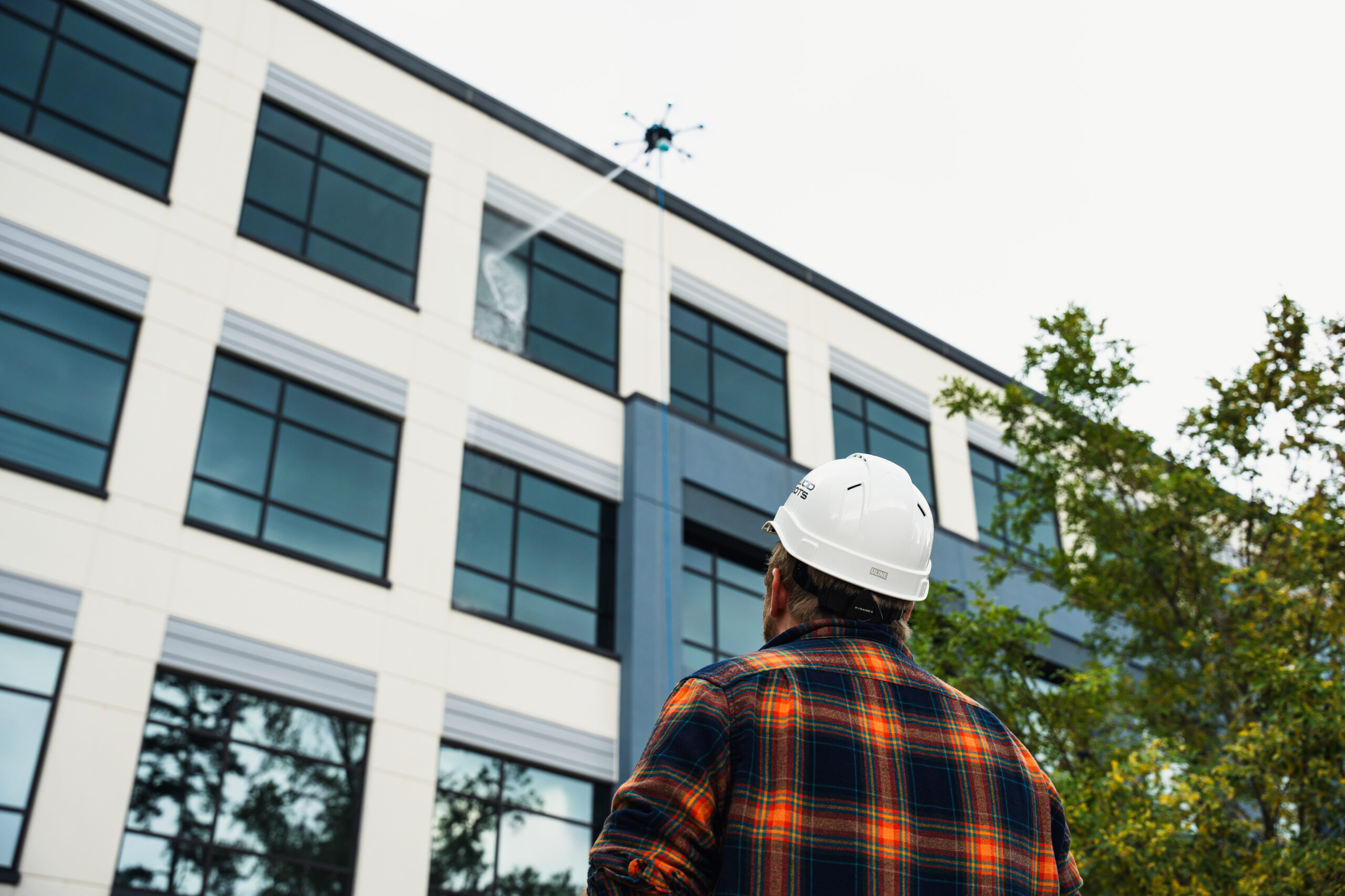 Drone with high resolution digital camera flying in the city